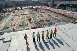 seven-construction-workers-standing-on-white-field.jpg seven construction workers standing on white field
